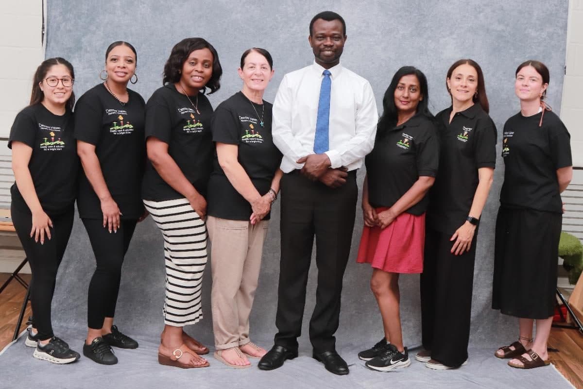 destiny haven nursery team poses together for a formal group photo